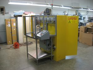 Custom chemical mixing machine with five dispensing pumps, weight scale and attached flammable liquids cabinet