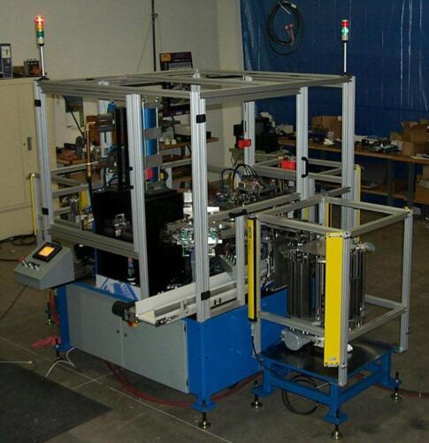 Automatic machine to assemble and press a 2 layer automotive gasket